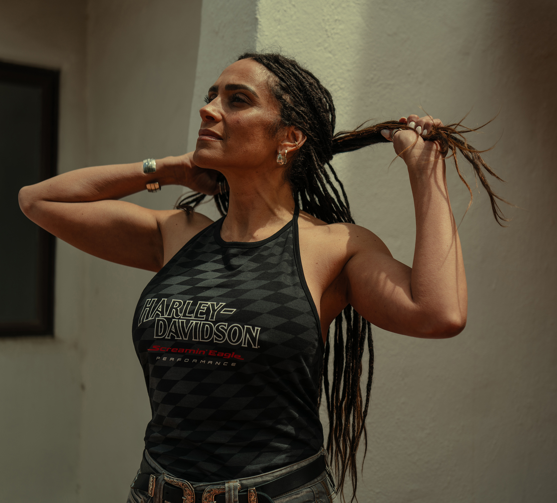 woman wearing black Harley-Davidson tank