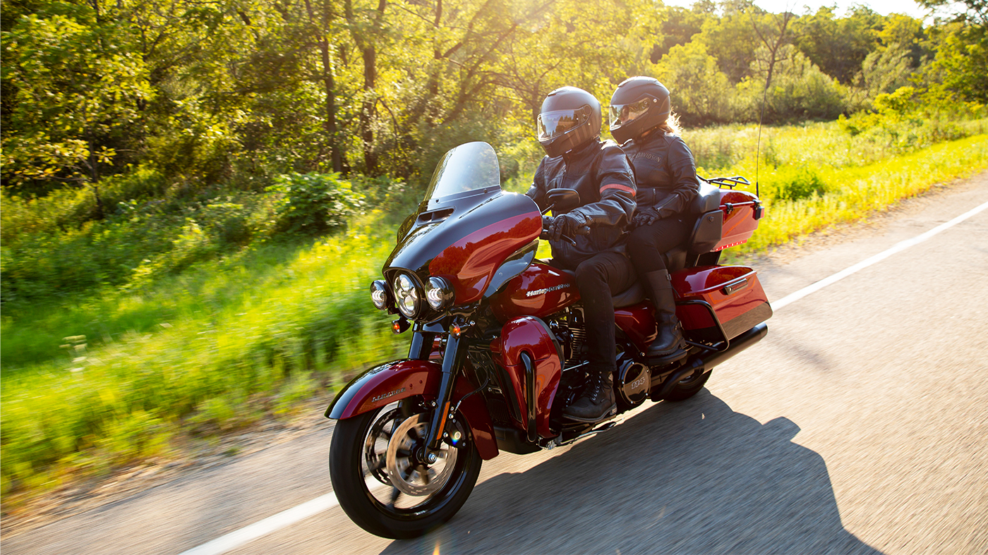 Couple riding Touring bike down the road